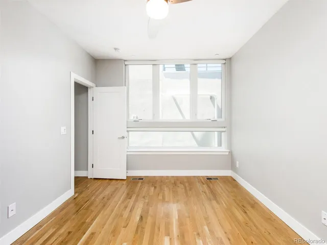 a bathroom with a granite countertop sink a toilet and bathtub