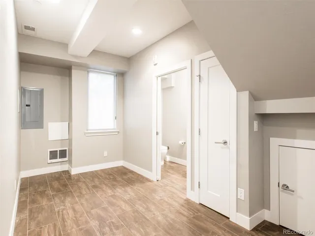 a bathroom with a sink a mirror and shower