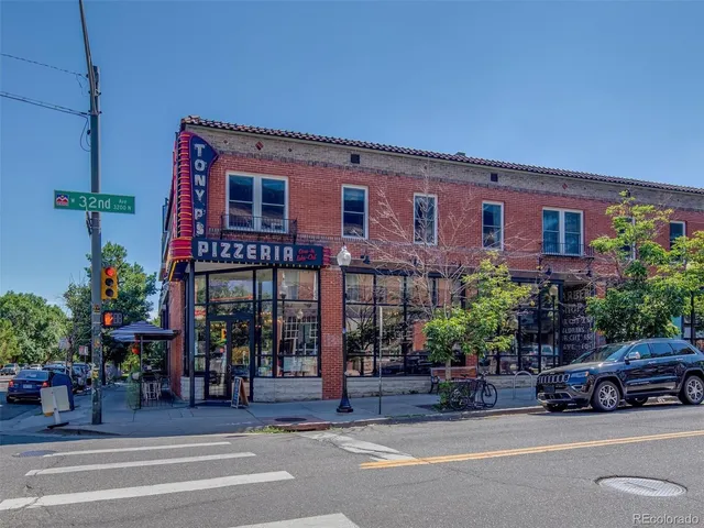 a view of a building with sitting area