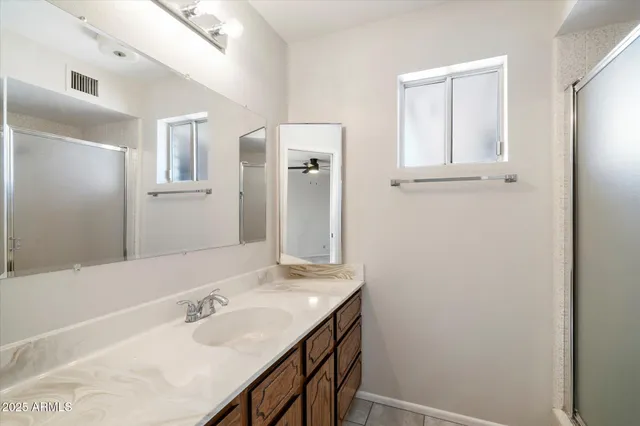 a view of a kitchen with furniture and a large window