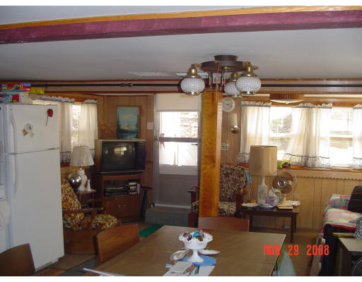 7 John Street Wareham, MA 02571 - Photo 4 of 6 a living room with furniture flowerpot and a chandelier