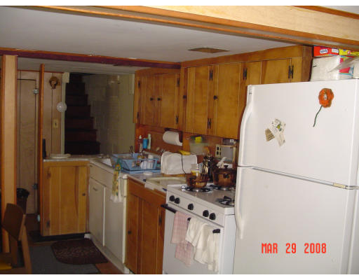 7 John Street Wareham, MA 02571 - Photo 5 of 6 a kitchen with a refrigerator and a stove