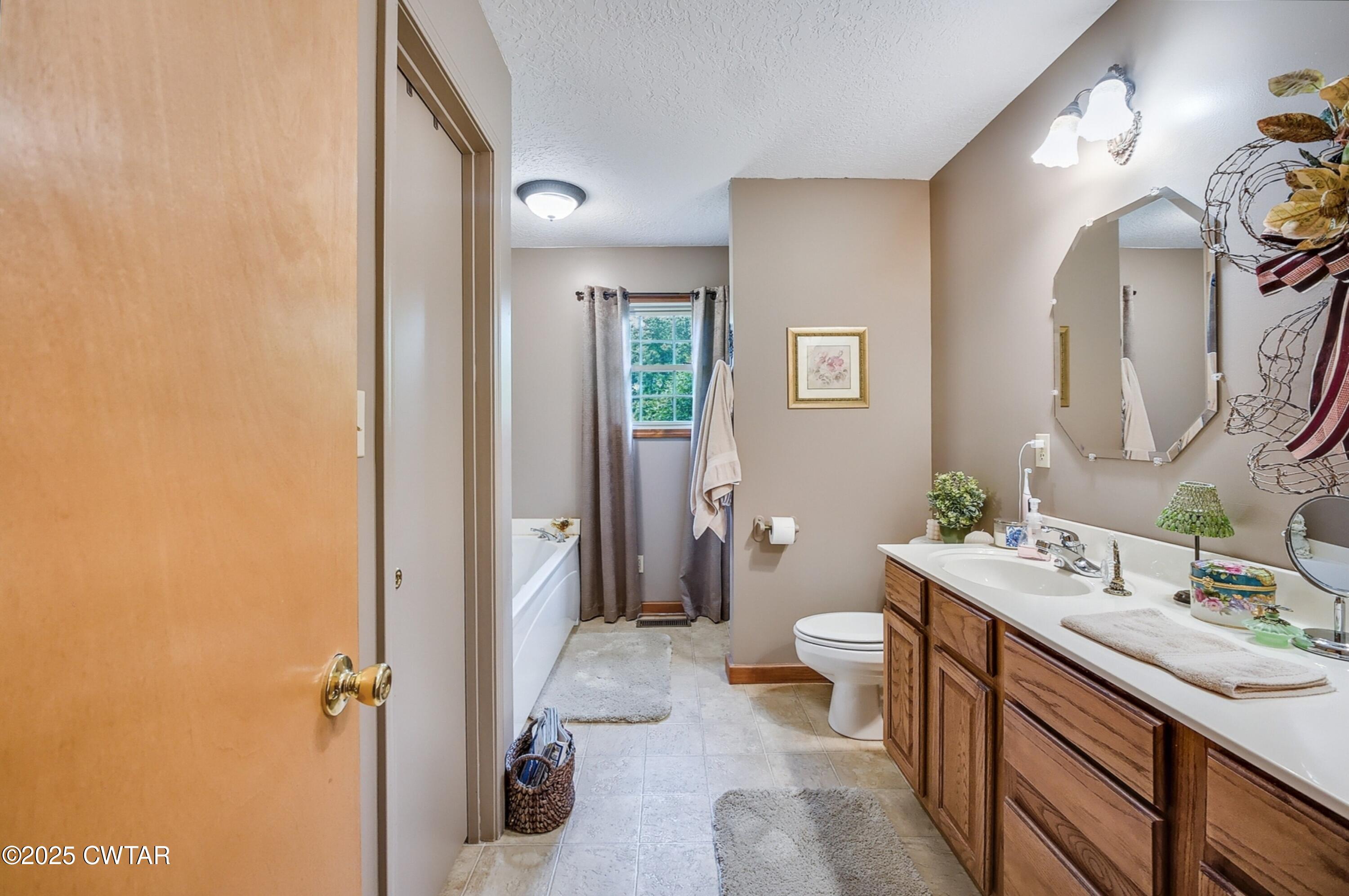 95 Stavely Road Medina, TN 38355 - Photo 15 of 33 a bathroom with a sink a toilet and shower
