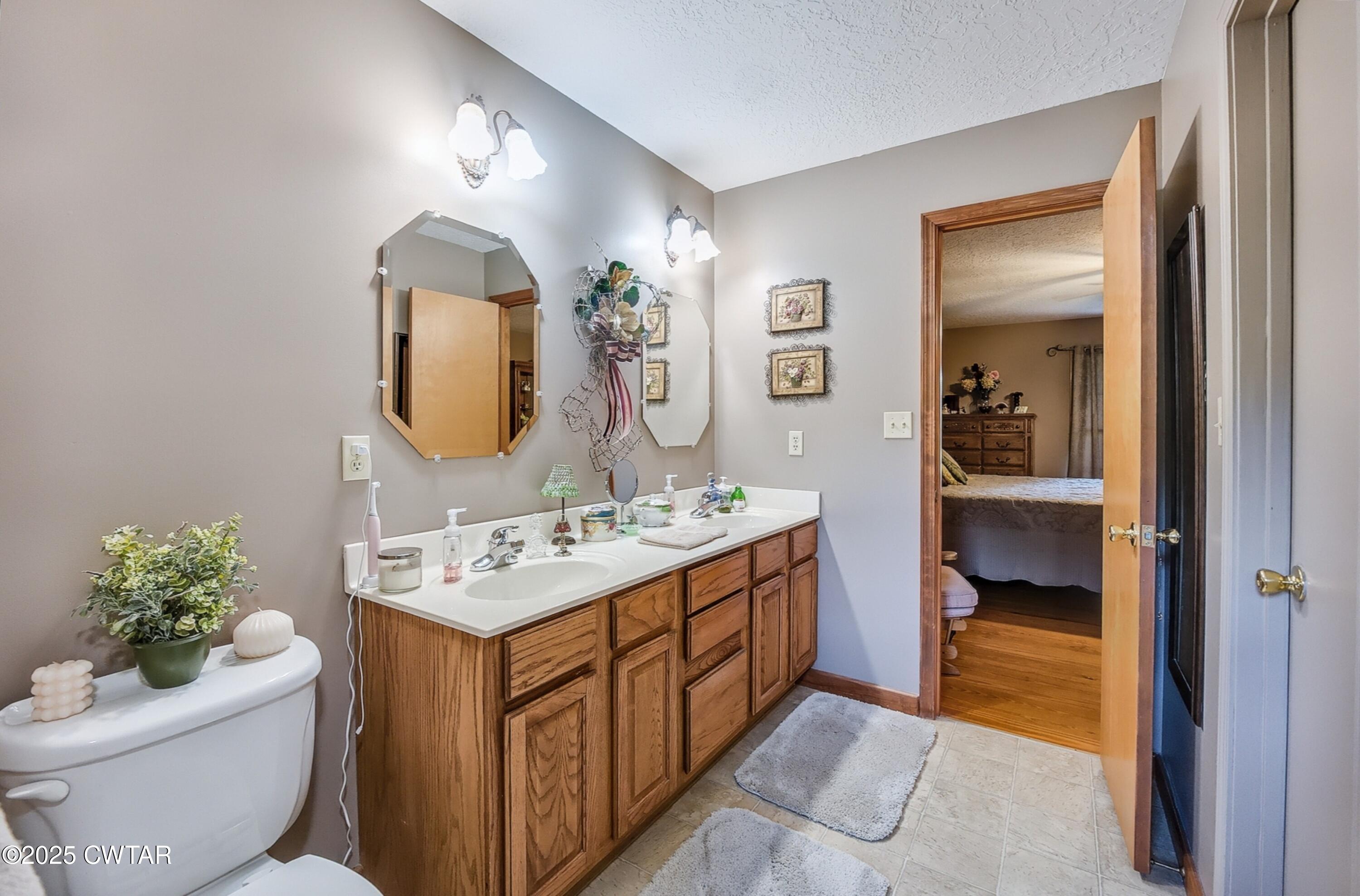 95 Stavely Road Medina, TN 38355 - Photo 16 of 33 a bathroom with a toilet sink and mirror