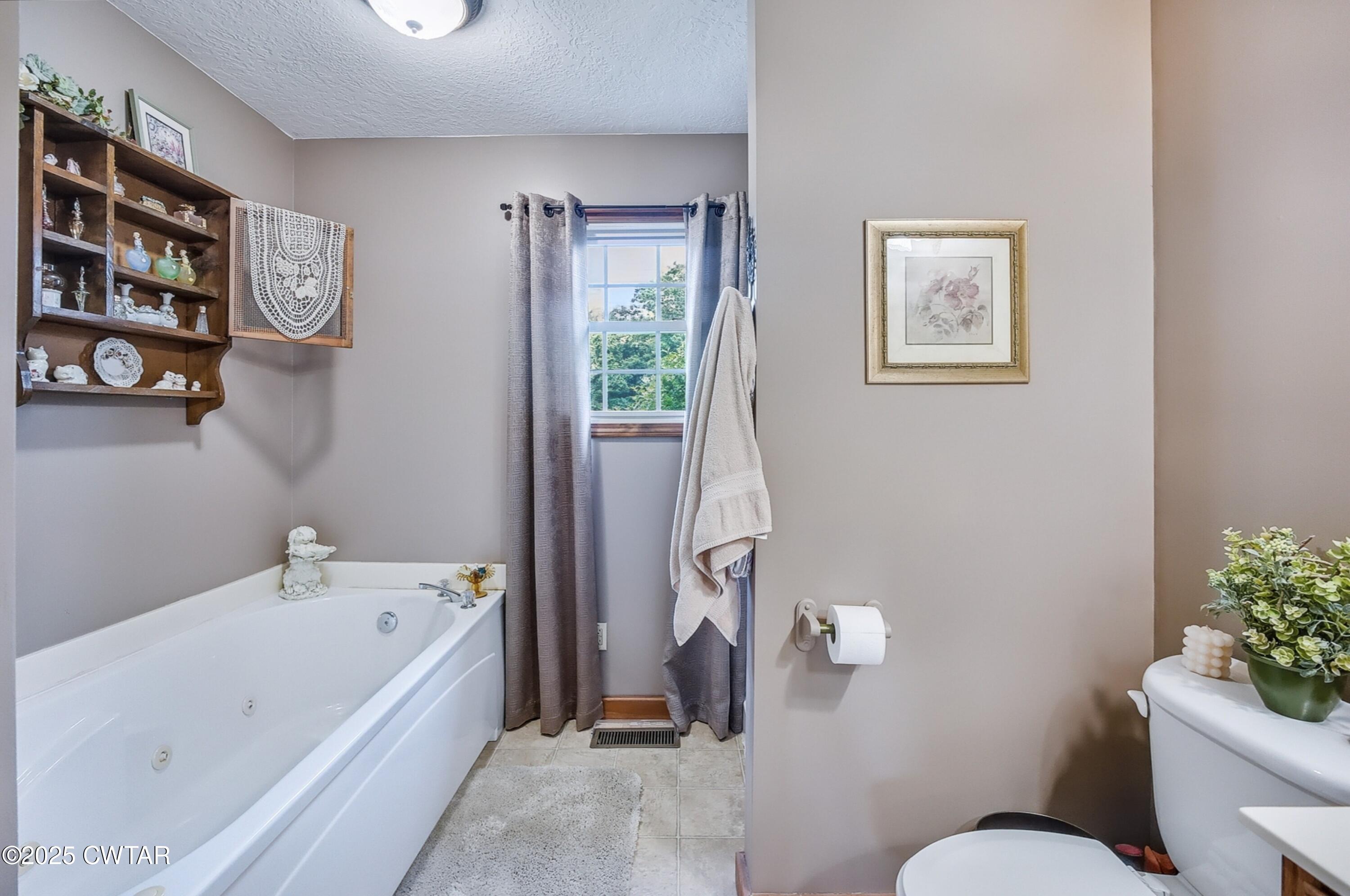 95 Stavely Road Medina, TN 38355 - Photo 17 of 33 a bathroom with a bathtub sink and toilet