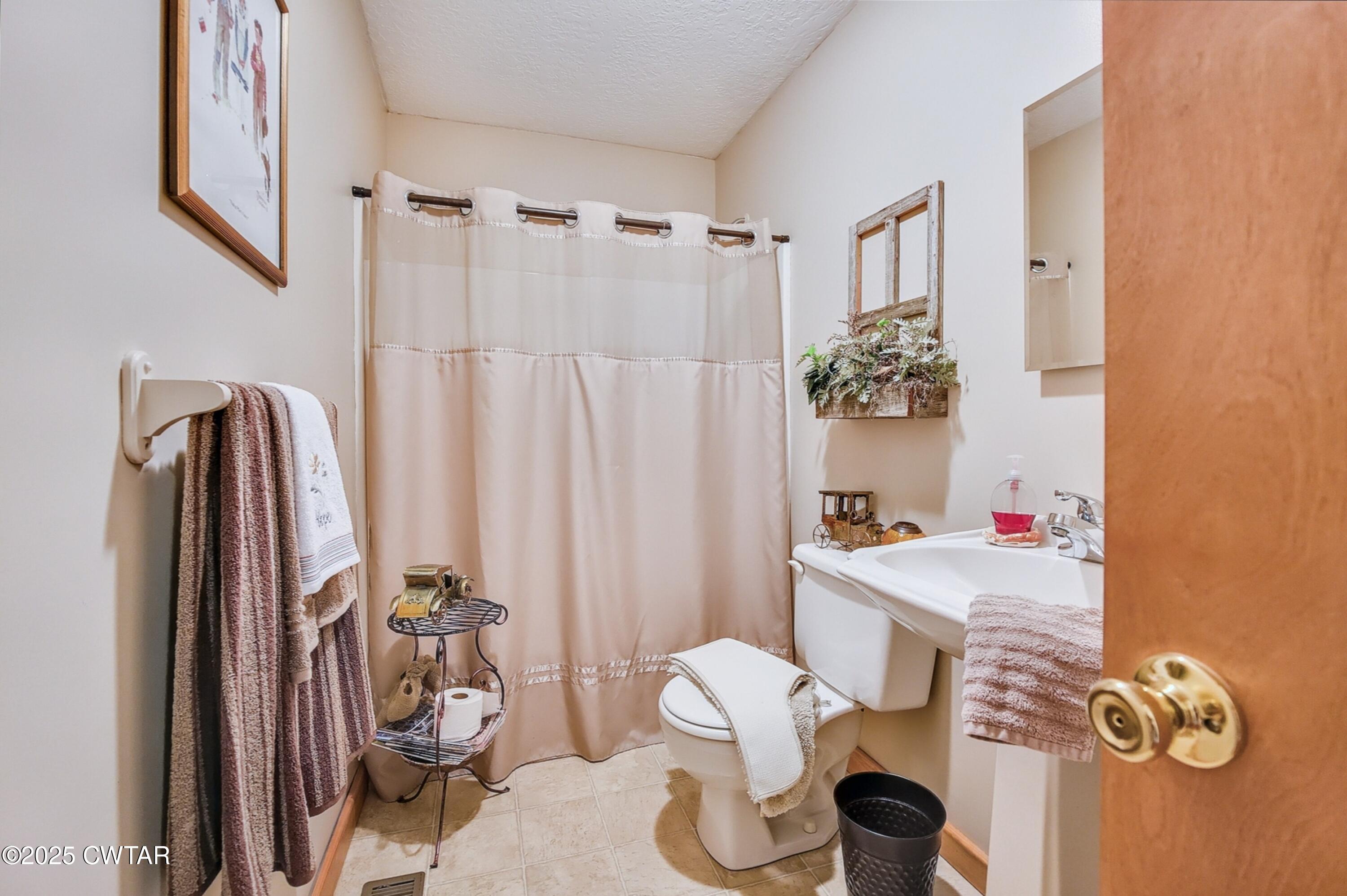 95 Stavely Road Medina, TN 38355 - Photo 19 of 33 a view of a livingroom with furniture and a floor to ceiling window