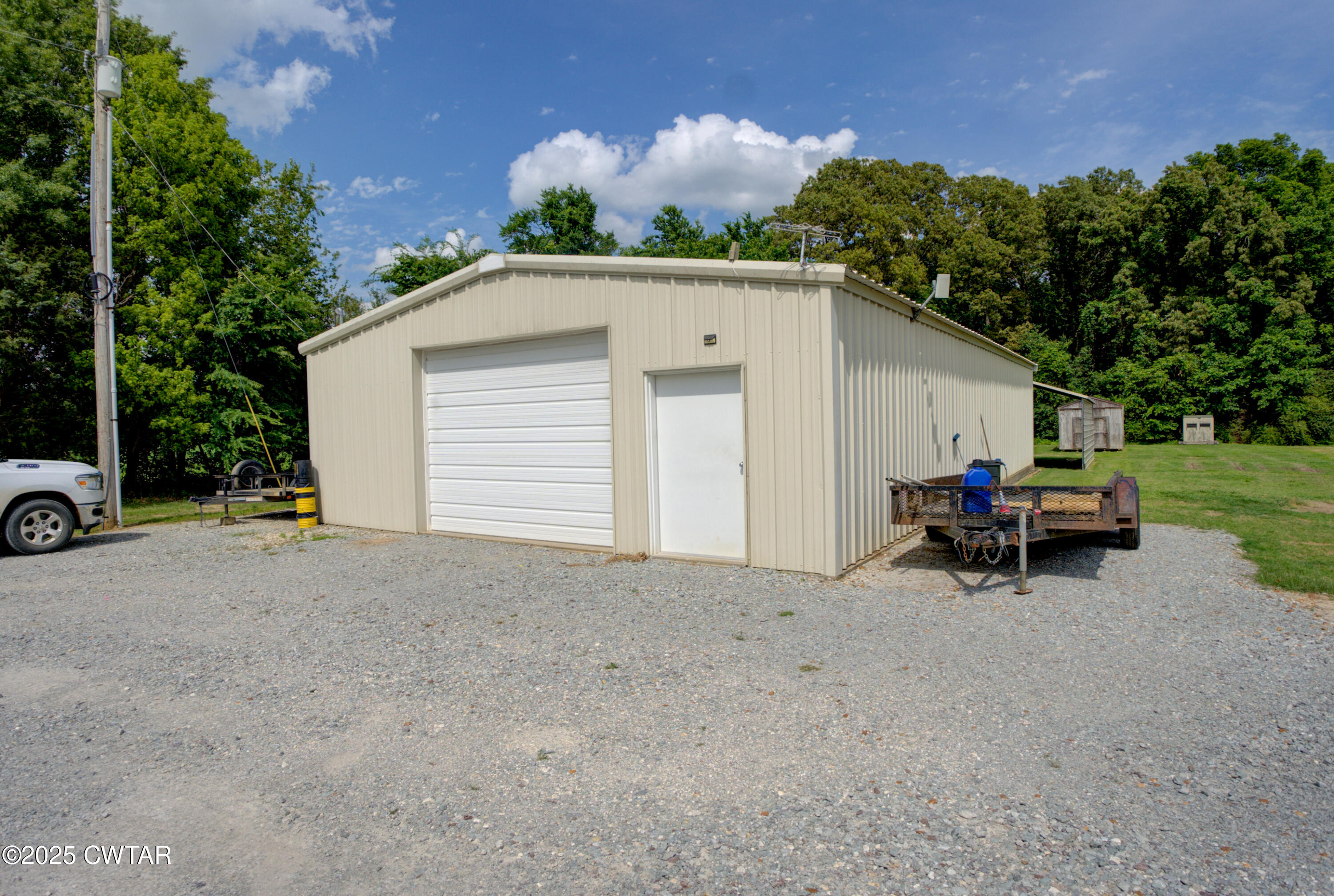 95 Stavely Road Medina, TN 38355 - Photo 3 of 33 a view of backyard with a table and chairs