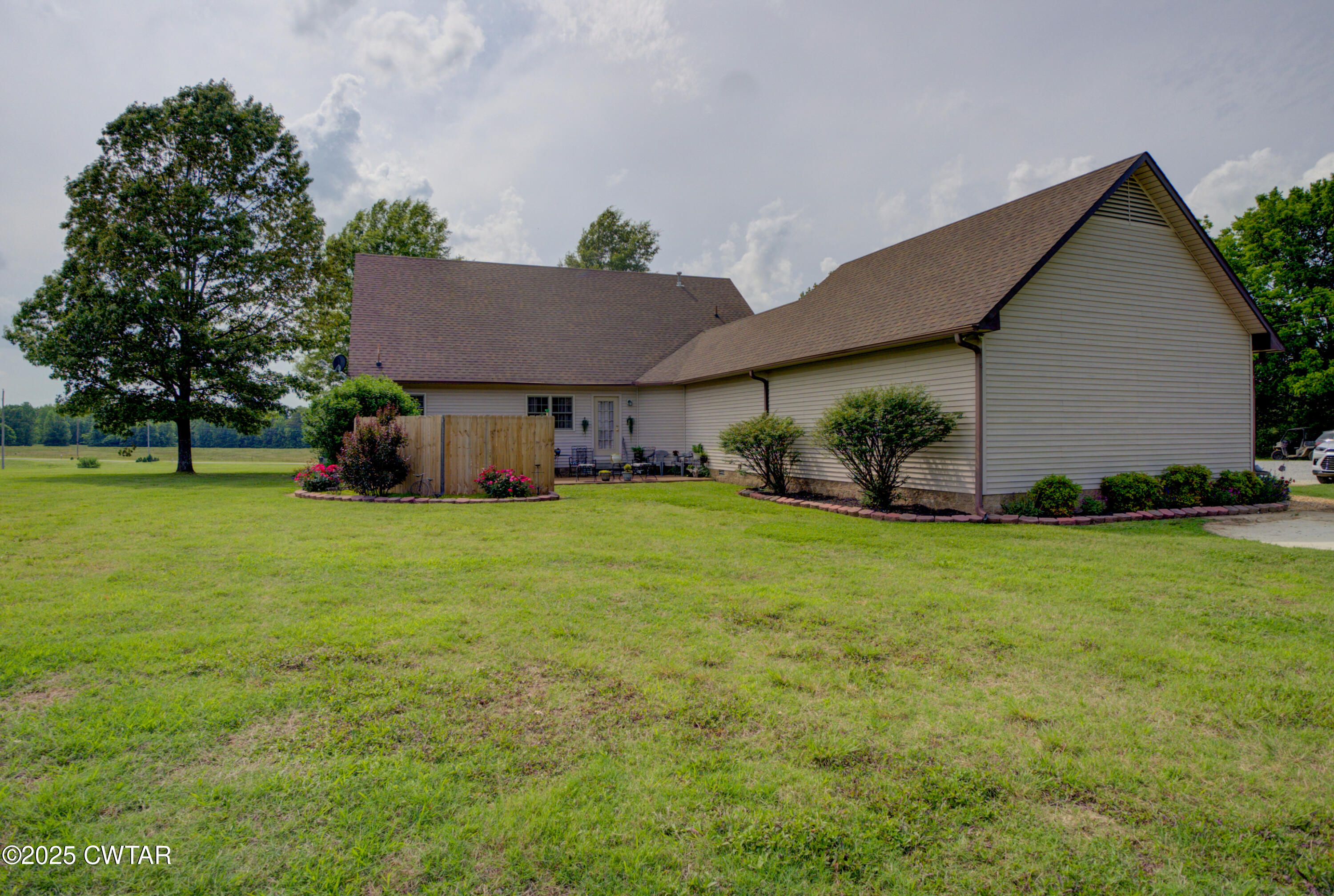 95 Stavely Road Medina, TN 38355 - Photo 32 of 33 a view of an house with backyard space and garden