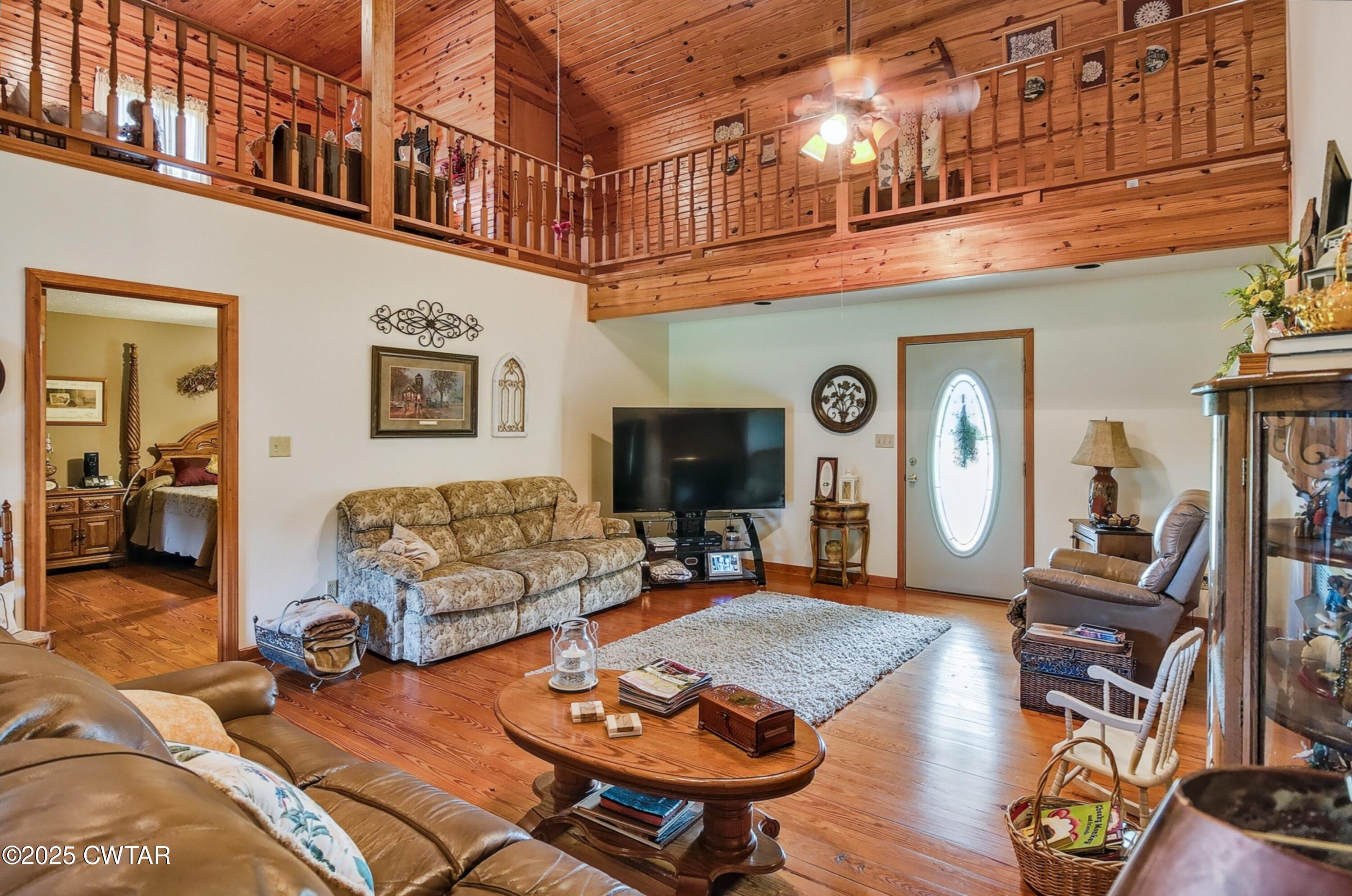 95 Stavely Road Medina, TN 38355 - Photo 7 of 33 a living room with furniture a flat screen tv and a table