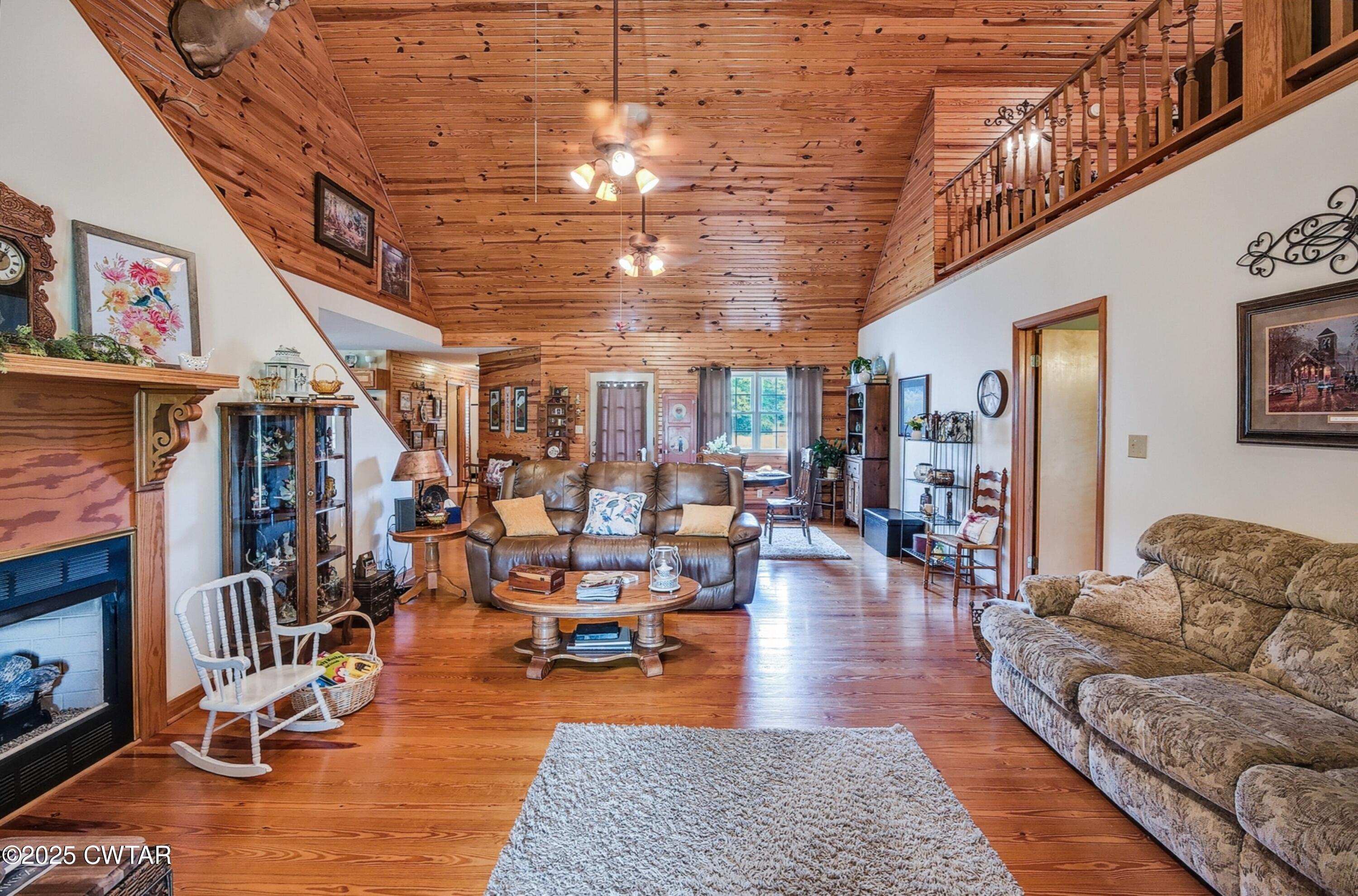 95 Stavely Road Medina, TN 38355 - Photo 8 of 33 a living room with lots of furniture and wooden floor