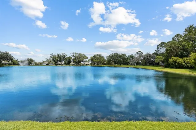 a spacious bathroom with a granite countertop sink mirror and a