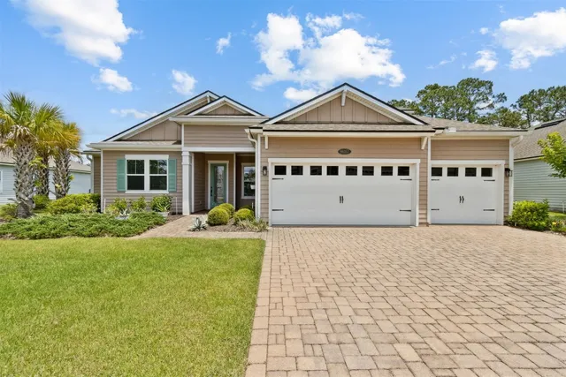 an empty room with wooden floor mirror and windows