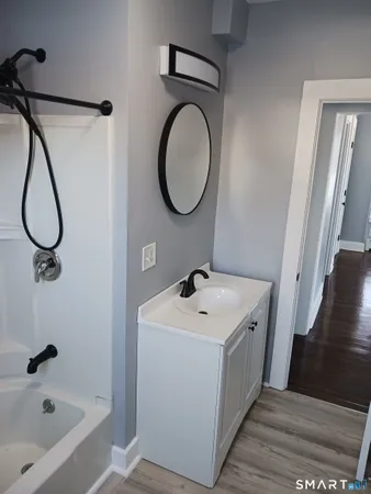 a bathroom with a sink a toilet and a bathtub