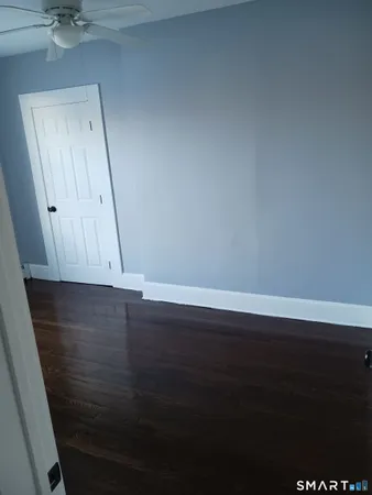 an empty room with wooden floor