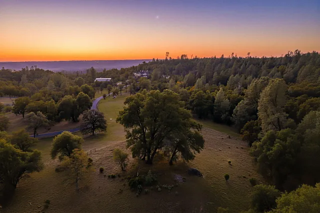 an aerial view of house with mountain view
