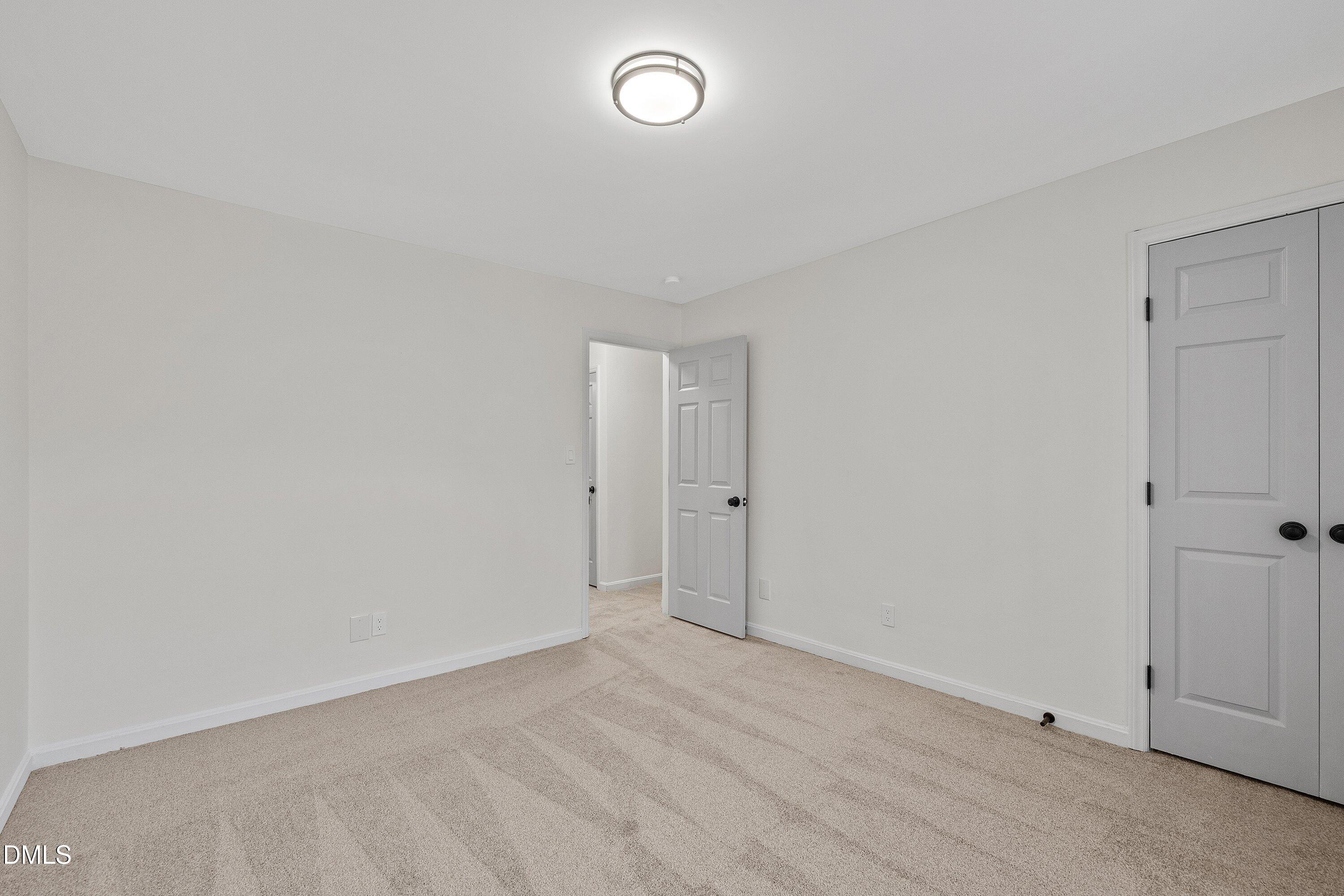 4705 Blue Bird Court, Unit E Raleigh, NC 27606 - Photo 23 of 32 a view of an empty room