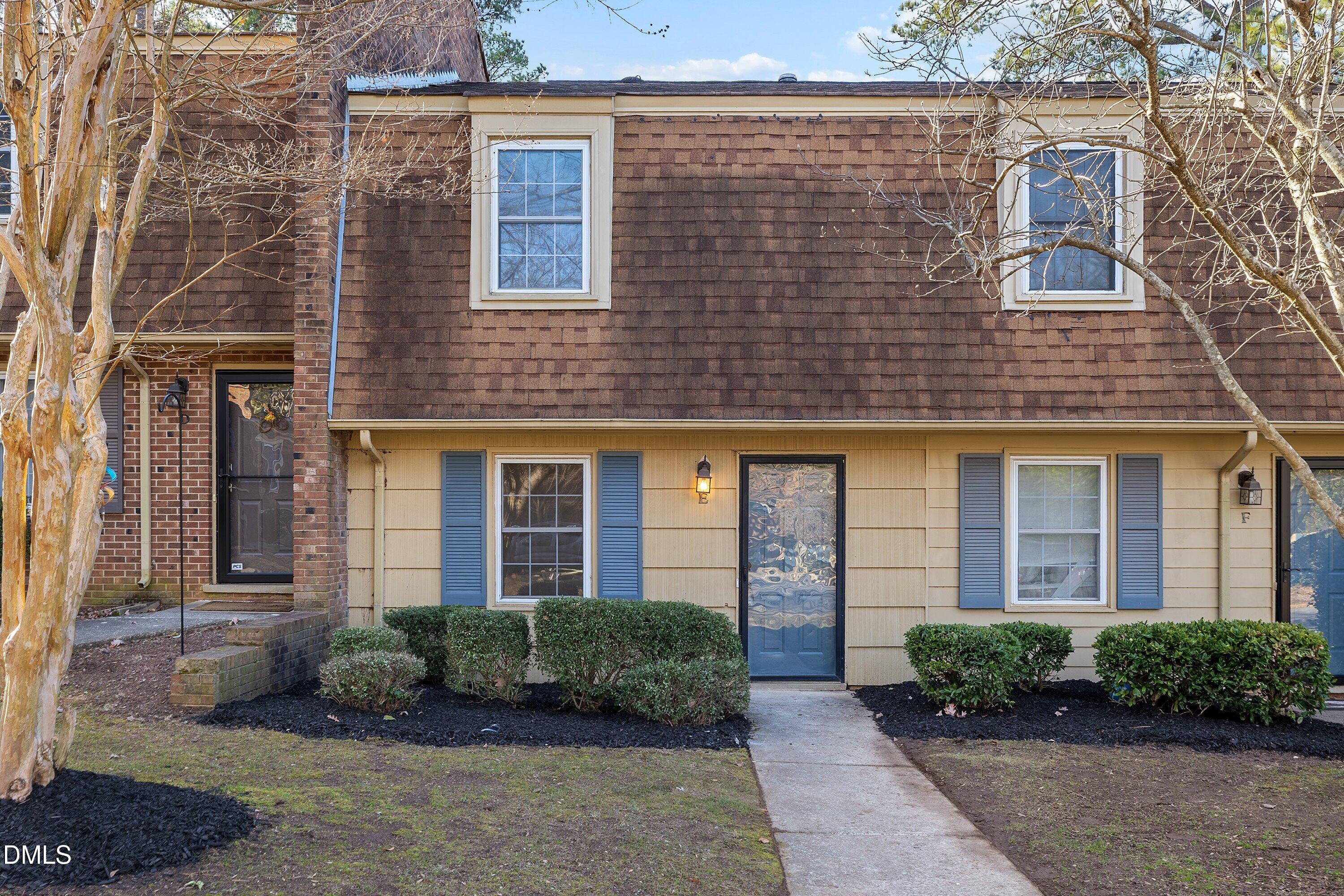 4705 Blue Bird Court, Unit E Raleigh, NC 27606 - Photo 30 of 32 a brick building with a large windows