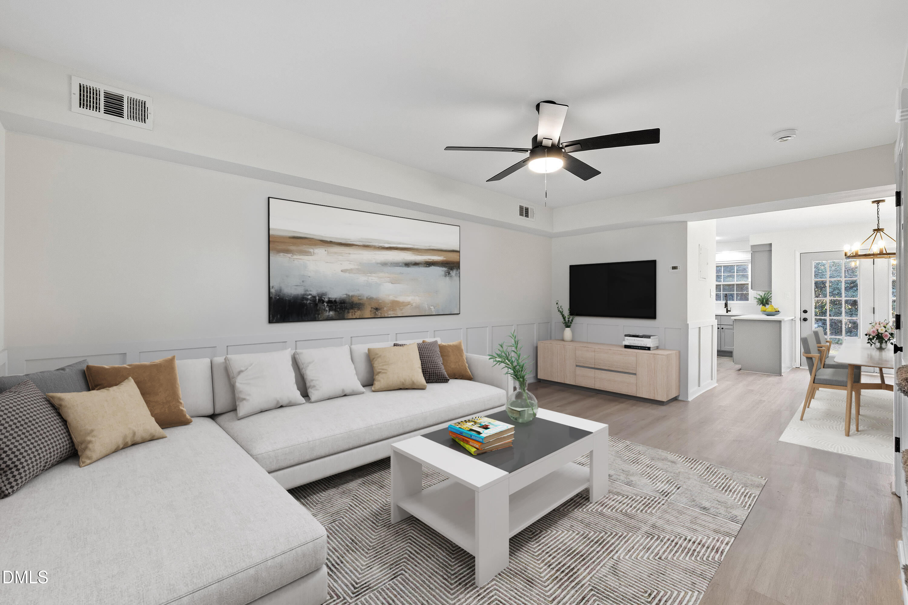 4705 Blue Bird Court, Unit E Raleigh, NC 27606 - Photo 5 of 32 a living room with furniture and a flat screen tv