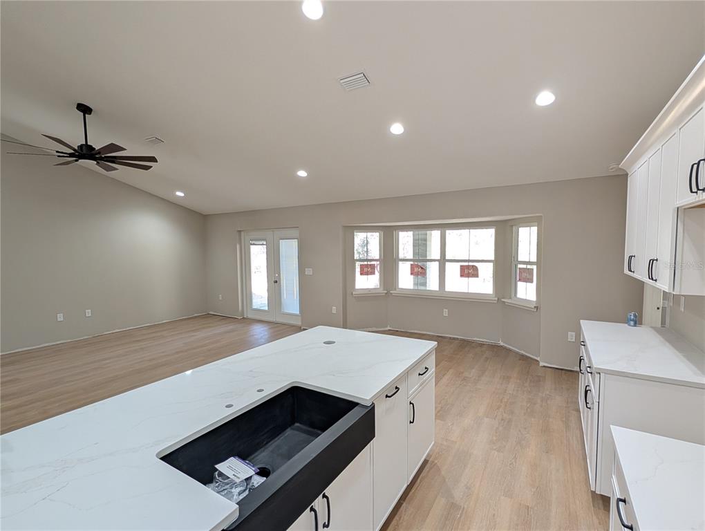 12769 Southwest 89th Street Dunnellon, FL 34432 - Photo 5 of 13 a view of kitchen and sink with wooden floor