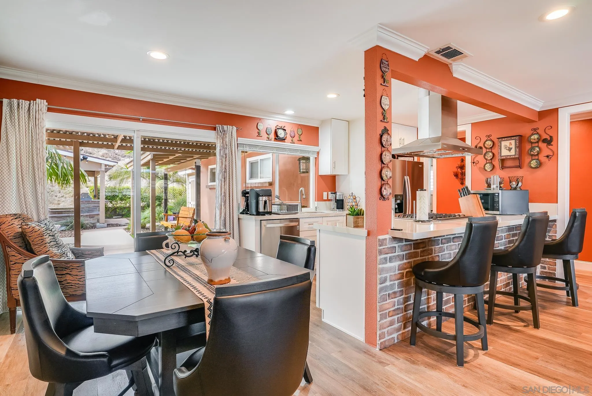 1851 Ithaca Street Chula Vista, CA 91913 - Photo 11 of 34 a dining room with furniture a fireplace and wooden floor