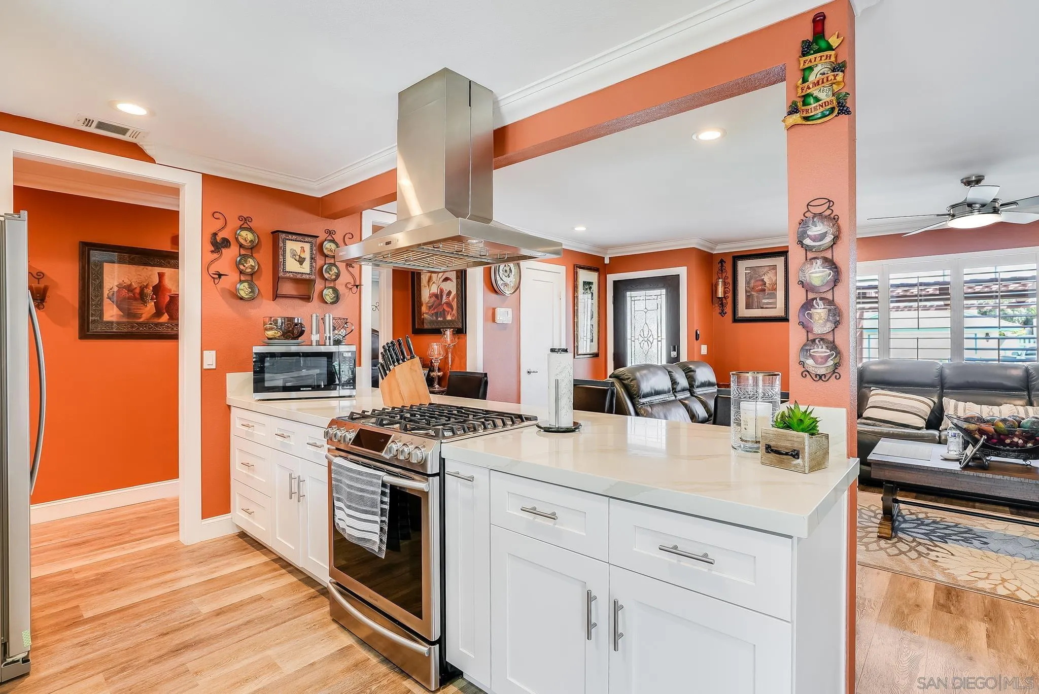 1851 Ithaca Street Chula Vista, CA 91913 - Photo 13 of 34 a kitchen with stainless steel appliances granite countertop a stove and more cabinets