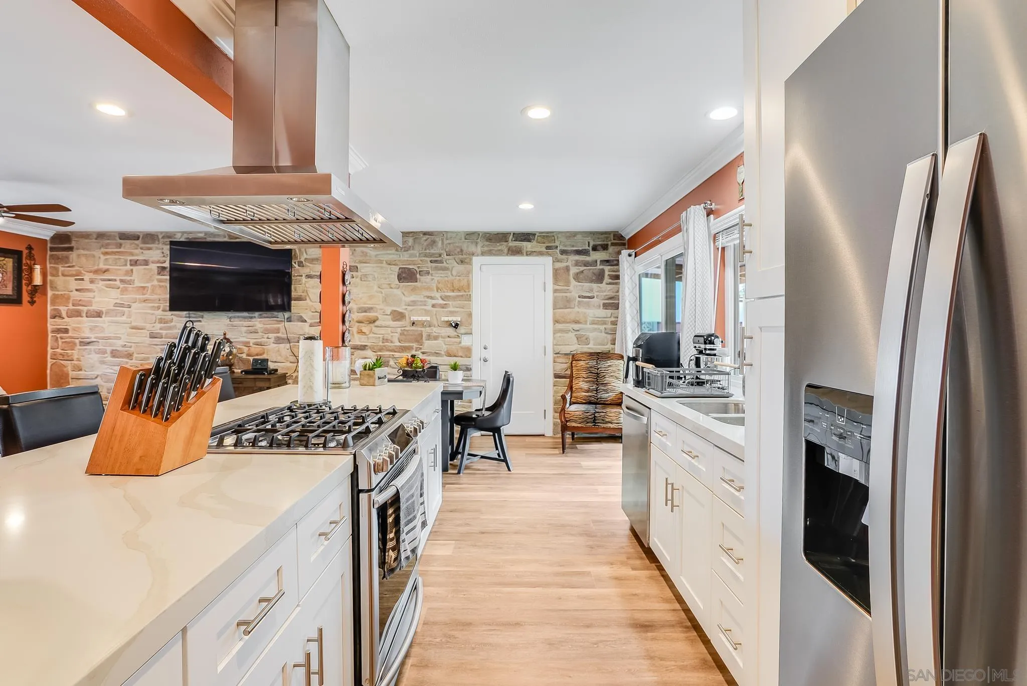 1851 Ithaca Street Chula Vista, CA 91913 - Photo 14 of 34 a kitchen with stainless steel appliances granite countertop a lot of counter space and a sink