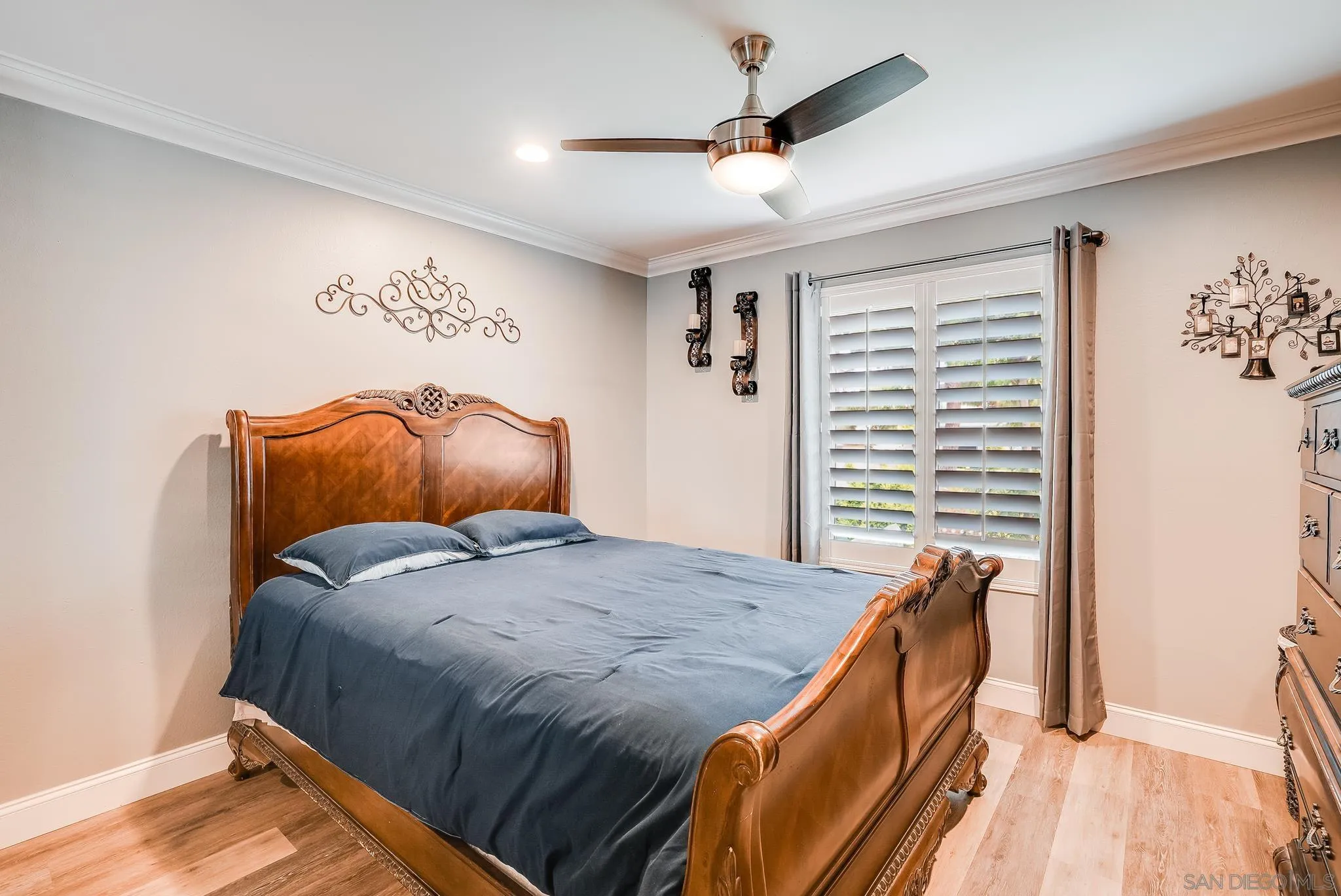 1851 Ithaca Street Chula Vista, CA 91913 - Photo 17 of 34 a bedroom with a bed and a chandelier