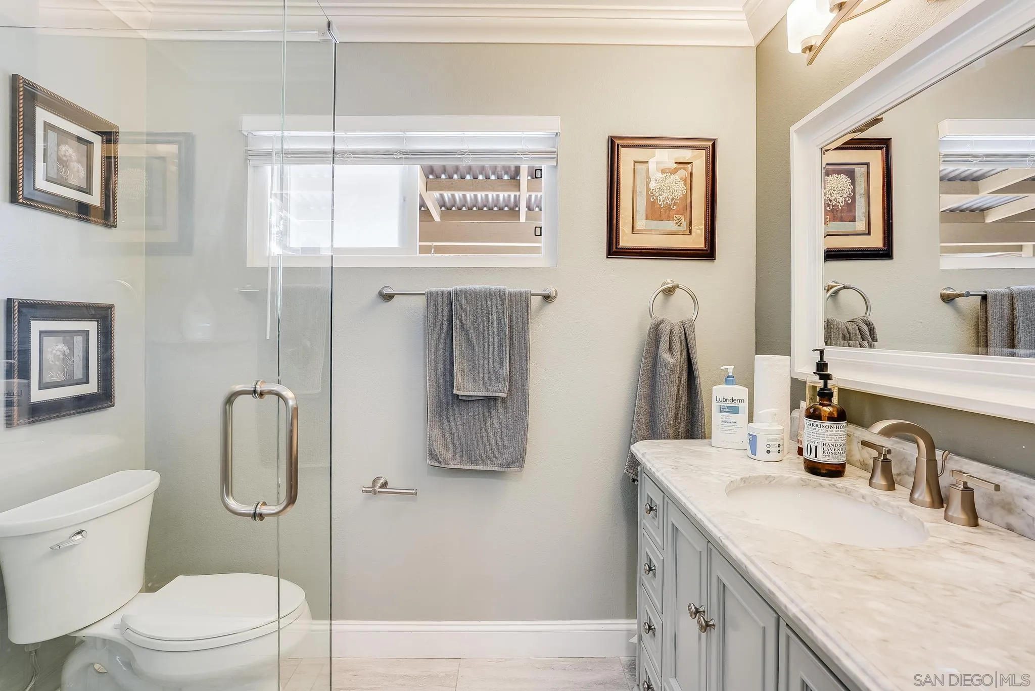 1851 Ithaca Street Chula Vista, CA 91913 - Photo 24 of 34 a bathroom with a granite countertop sink toilet and shower