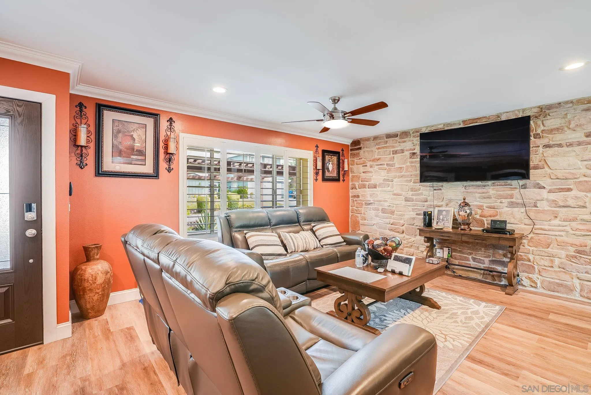 1851 Ithaca Street Chula Vista, CA 91913 - Photo 7 of 34 a living room with furniture a flat screen tv and a large window