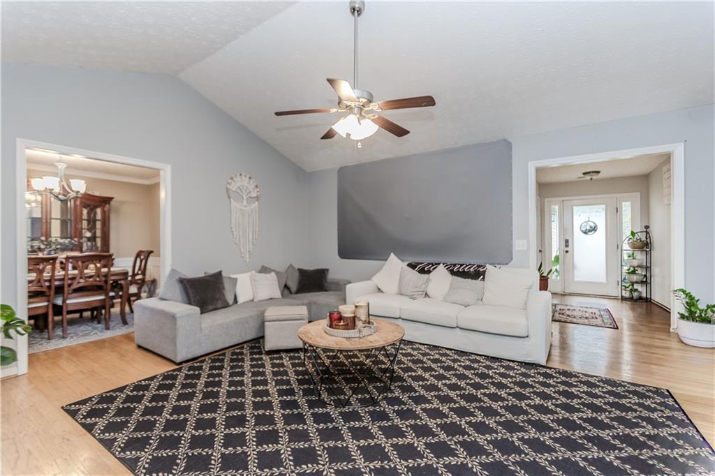 2790 Alcovy River View Dacula, GA 30019 - Photo 14 of 25 a living room with furniture and wooden floor