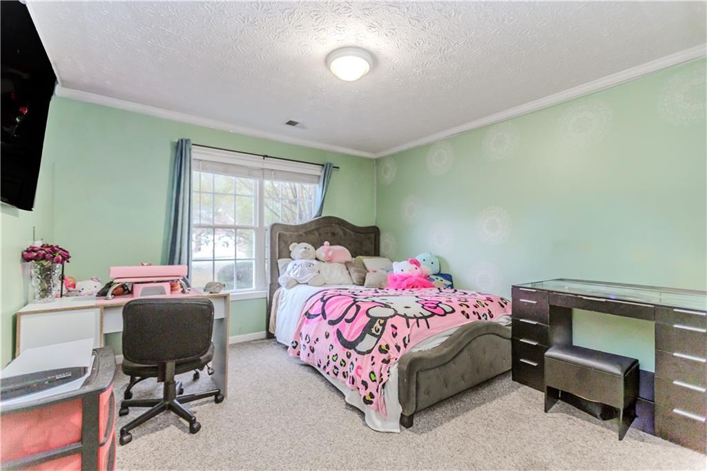 2790 Alcovy River View Dacula, GA 30019 - Photo 19 of 25 a bedroom with a bed and a window