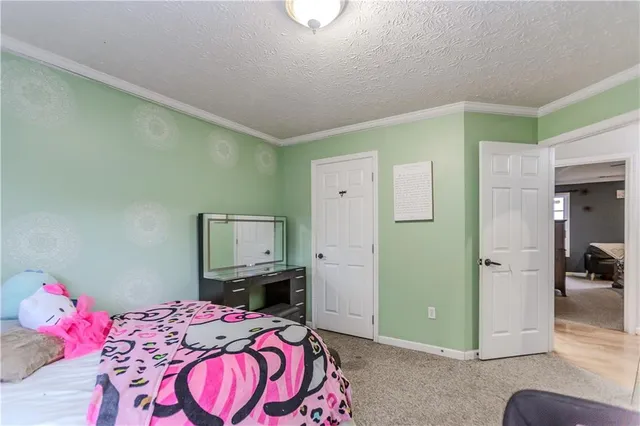 a bedroom with a bed and a mirror