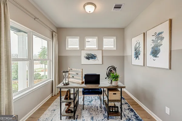 a living room with furniture and a window
