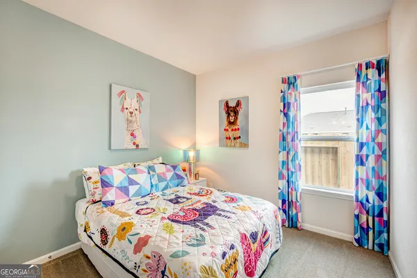 a bedroom with a bed and a cabinets