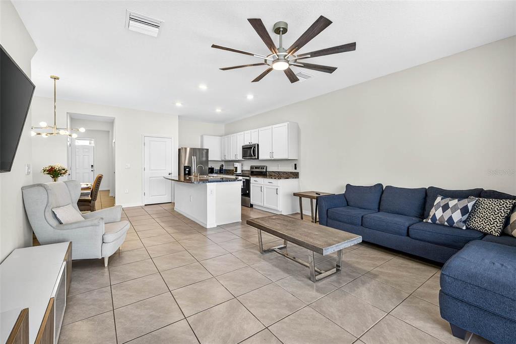 193 Mangrove Shade Circle Apollo Beach, FL 33572 - Photo 16 of 47 a living room with furniture and kitchen view