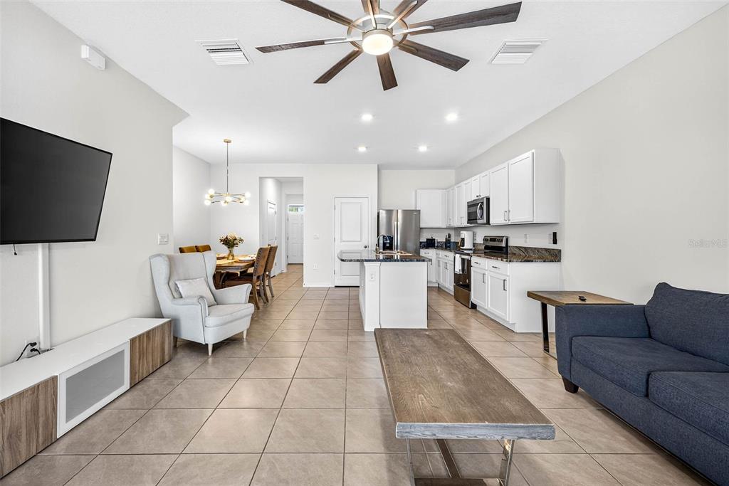 193 Mangrove Shade Circle Apollo Beach, FL 33572 - Photo 17 of 47 a living room with furniture and a flat screen tv