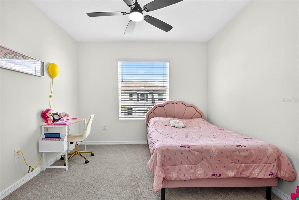 193 Mangrove Shade Circle Apollo Beach, FL 33572 - Photo 23 of 47 a bedroom with a bed and a window