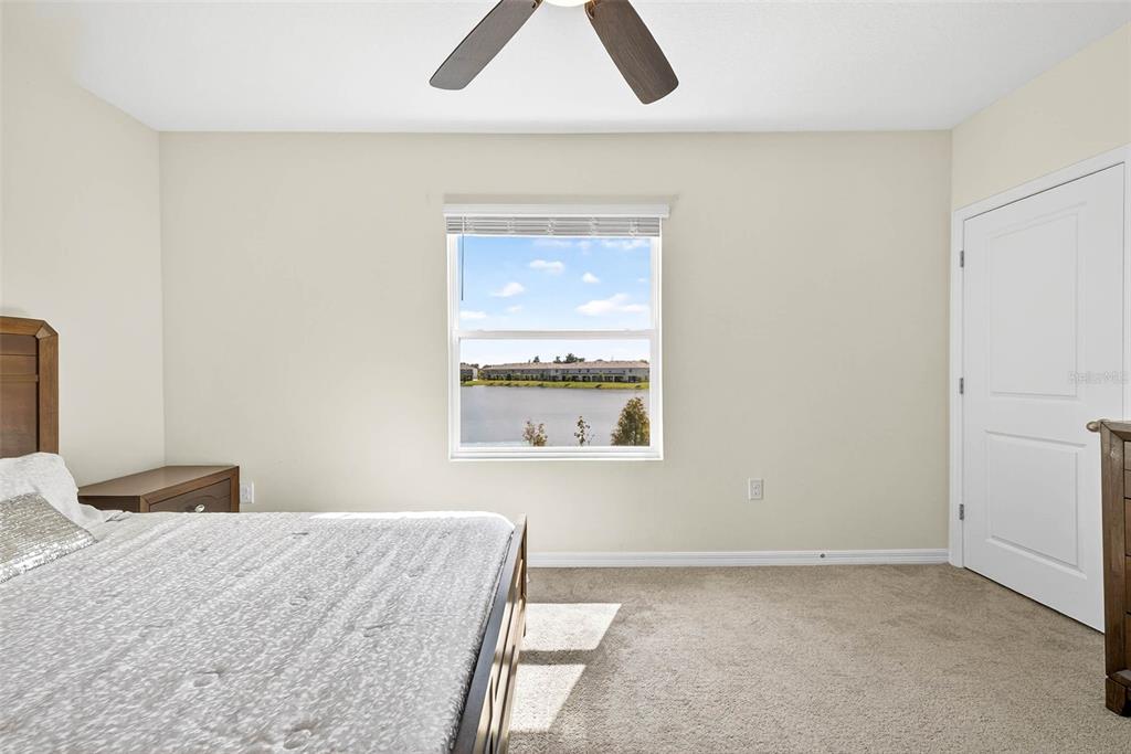 193 Mangrove Shade Circle Apollo Beach, FL 33572 - Photo 28 of 47 a bedroom with a bed and a window