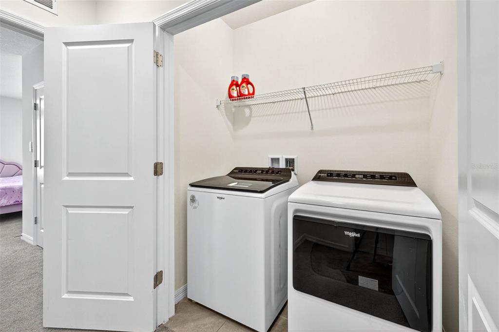 193 Mangrove Shade Circle Apollo Beach, FL 33572 - Photo 31 of 47 a utility room with dryer and washer