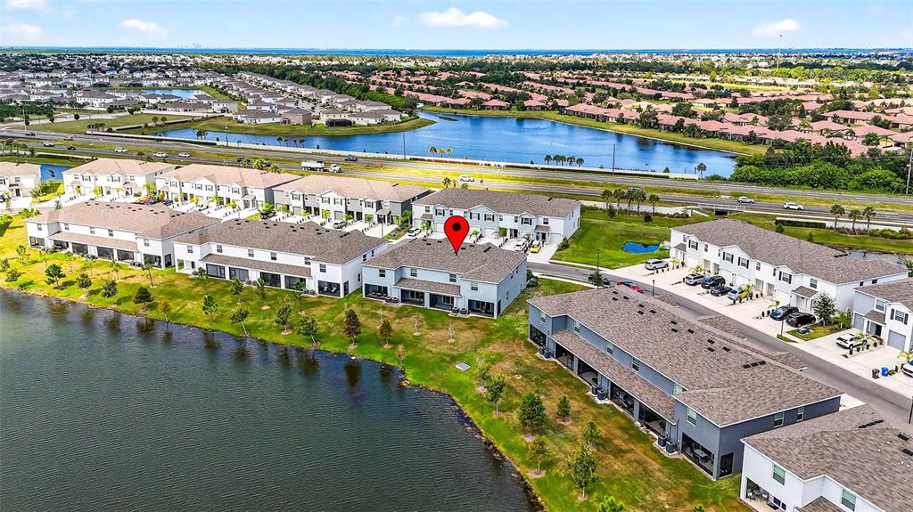 193 Mangrove Shade Circle Apollo Beach, FL 33572 - Photo 44 of 47 a view of an ocean and a city