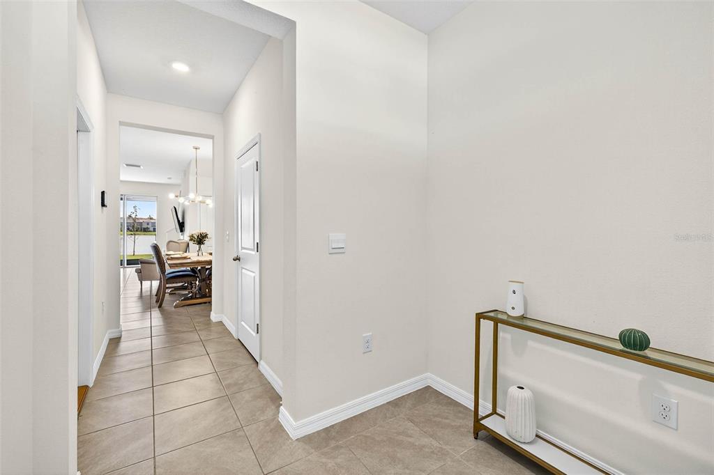 193 Mangrove Shade Circle Apollo Beach, FL 33572 - Photo 6 of 47 a view of a hallway with dining room and stairs