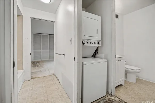 a kitchen with sink refrigerator and cabinets