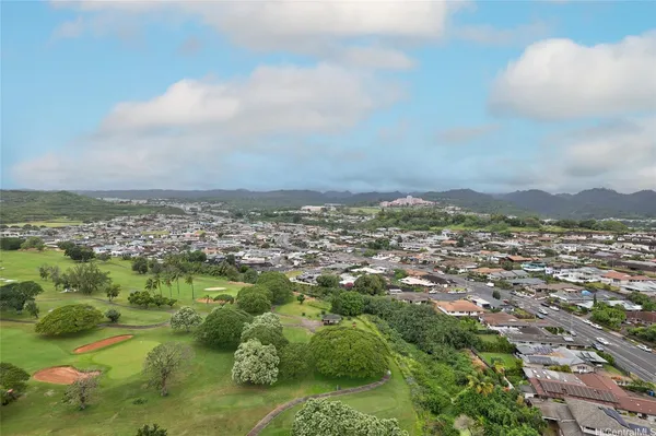 a view of city and mountain from a balcony