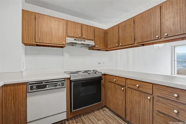a kitchen with stainless steel appliances a sink a stove and a refrigerator
