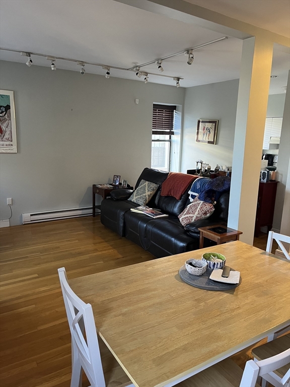 14 Linwood Street, Unit 2 Boston, MA 02119 - Photo 4 of 23 a living room with furniture and wooden floor