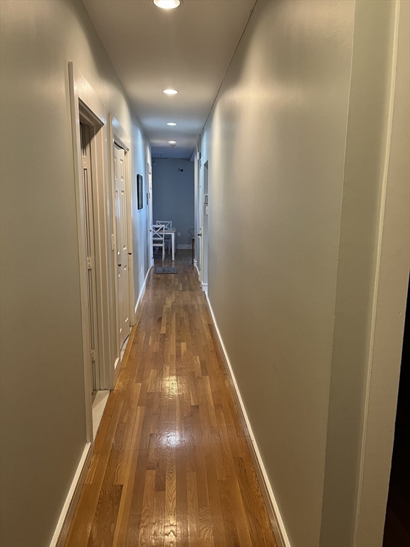 14 Linwood Street, Unit 2 Boston, MA 02119 - Photo 6 of 23 a view of a hallway with wooden floor