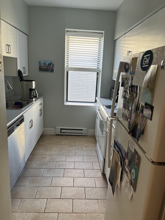 14 Linwood Street, Unit 2 Boston, MA 02119 - Photo 7 of 23 a view of a kitchen with fridge and workspace
