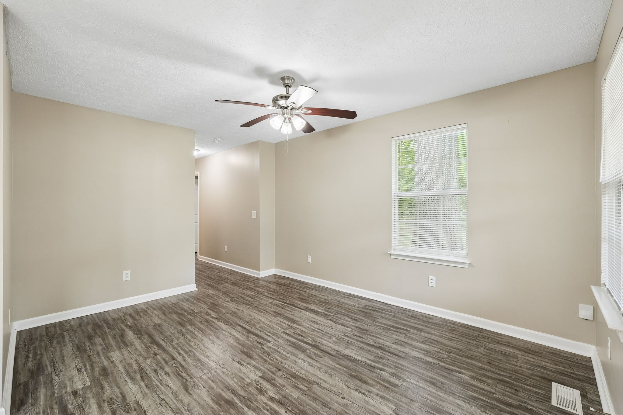 511 Hayes Street Springfield, TN 37172 - Photo 6 of 26 wooden floor in an empty room with a window