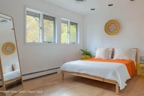 a bedroom with a bed and a window