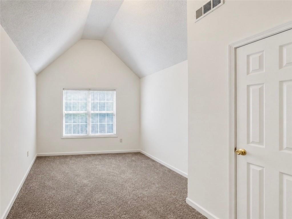 6936 Red Bone Way Stonecrest, GA 30038 - Photo 8 of 17 an empty room with a window
